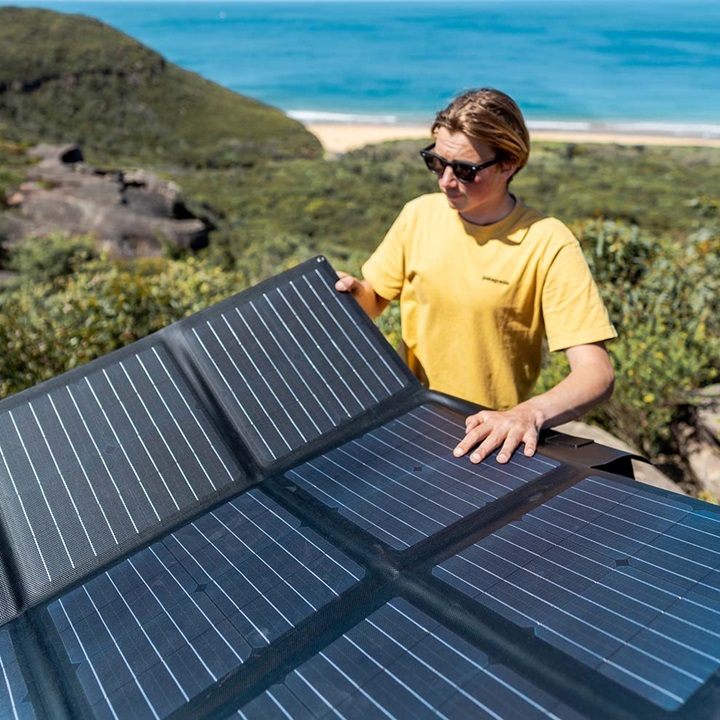 woman setting up solar blankets